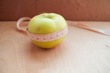 apple and measuring tape