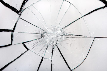 Obraz premium Broken glass with white refliction and black cracks. Artistic backround