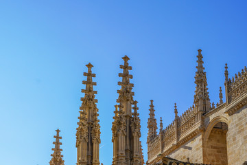 Facade of the Granada Cathedral against the blue sky, Andalusia, Spain.