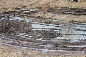 Tracks after rain, mud and roadless.