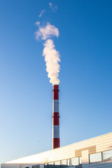 red white industry chimney smoke coming out
