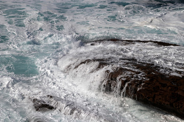 Waves hitting the shore in San Sebastian