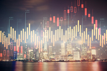 Fototapeta na wymiar Financial graph on night city scape with tall buildings background multi exposure. Analysis concept.
