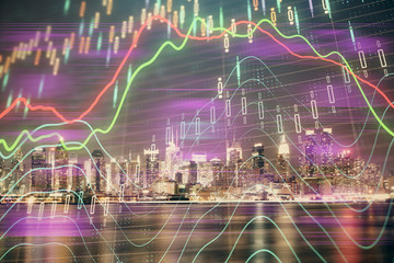 Financial graph on night city scape with tall buildings background multi exposure. Analysis concept.