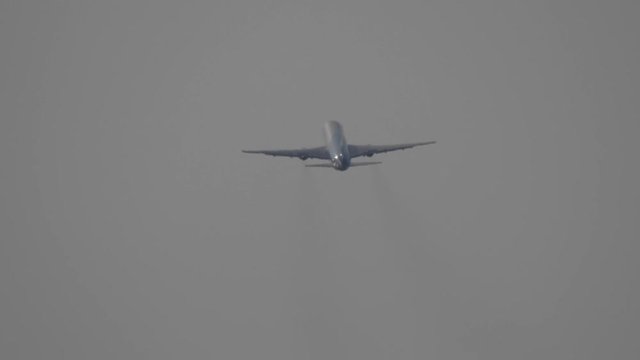 The take-off of a passenger plane from an airport lane