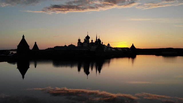 Smooth cinematic flight over the Solovetsky monastery during a beautiful sunset. Solovetsky monastery is an old Russian Orthodox Church monastery, located on the White sea's Islands
