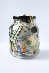 dollars are sealed with sealing wax in a glass jar