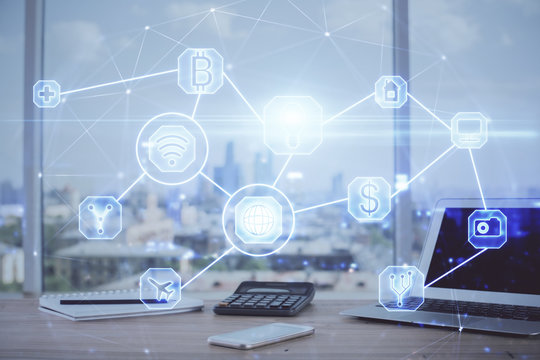 Computer on desktop with social network hologram. Multi exposure. Concept of international people connections.