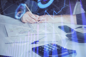 Double exposure of man doing analysis of stock market with forex graph.