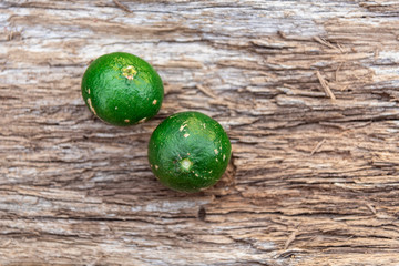 Fresh fruits of Citrus reticulata on aged wooden background