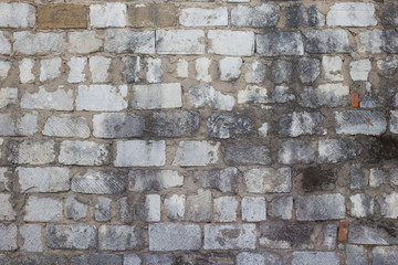 Old white stone wall with mold, horizontal texture. Dirty wall background