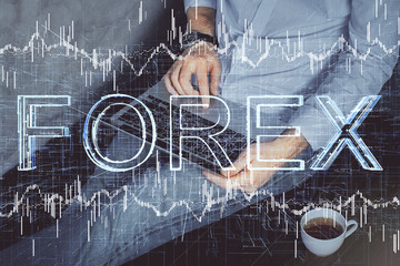 Forex graph with businessman working on computer in office on background. Concept of analysis....