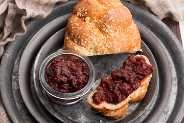 Sweet bread (challah) with cherry jam