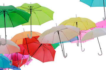 Green, red and blue parasols on a white background. Umbrella many colors.