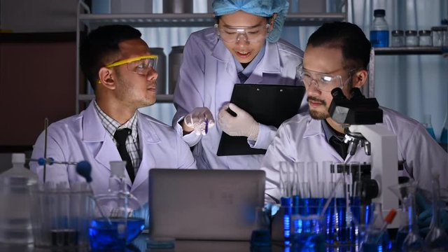 scientist team has researching in the laboratory, meeting and writing analysis results of coronavirus vaccine development in the laboratory, professional doctor  working research in biotechnology term