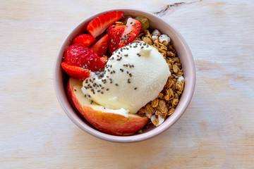 Granola with apple, strawberry and yogurt