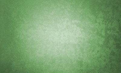 Green background in textured vintage spring or Christmas colors, old elegant green wall design with grunge texture and dark vignette border