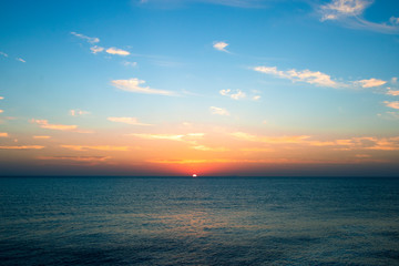 Seascape in early morning, sunrise over sea. Nature landscape. sunshine over the horizon with blue cloudy sky .wide scene of sunrise over the red sea, Egypt