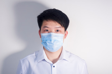 A man wearing a disposable medical surgical mask
