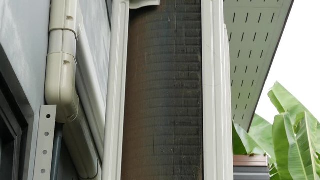 Air conditioning heat sink is dirty with dust. Scene is camera dolly in