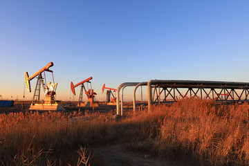 Fototapeta na wymiar Pumping unit and oil pipeline