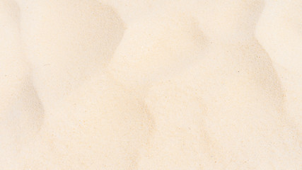 Closeup shot of sand texture on the beach as background