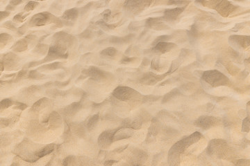 Closeup shot of sand texture on the beach as background - obrazy, fototapety, plakaty