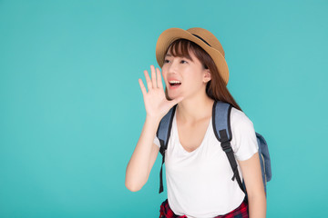 Fototapeta premium Beautiful young asian woman shouting sound loud with mouth for announce something in vacation travel with excited isolated on blue background, tourist asia girl journey in summer concept.