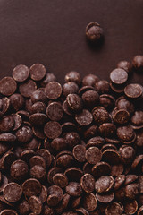 milk chocolate pieces preform candies in daylight for background
