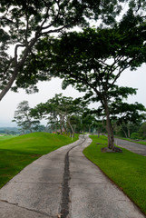 Fototapeta na wymiar Concrete road on a golf course called La Reunion in Guatemala, destroyed by volcano eruption called de Fuego, was an important tourist destination of great foreign investment.