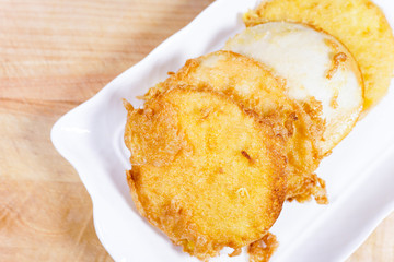 Fried bread slices with eggs in plate