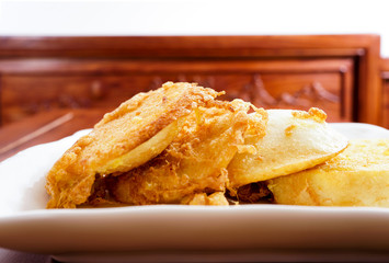 Fried bread slices with eggs in plate