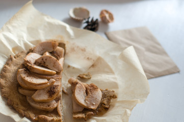 Apple pie on white wooden table 
