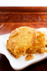 Fried bread slices with eggs in plate