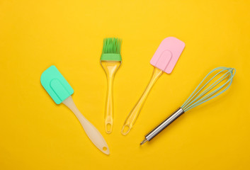 Flat lay compoisition of kitchen tools on yellow background. Minimalism. Top view