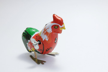 Thai vintage toys, colorful chicken made from zinc on white background