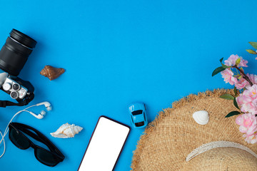 Flat lay Traveller accessories on blue background with copy space, Summer background.