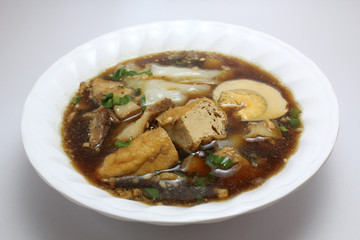 Chinese roll noodle soup (Guay Jub Nam Kon call in Thai) with crunchy pork, egg and cinnamon in...