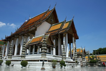 Fototapeta na wymiar Main church with blue sky at Wat Suthat Thepwararam, temple in Bangkok, Thailand