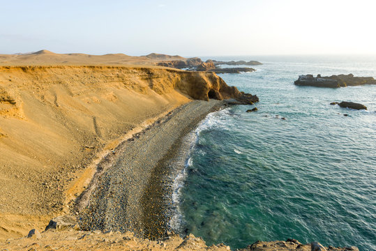 Panoramic view of a rocky beach with green-blue seawater at Huarmey&acute;s seaside in Ancash region, Peru