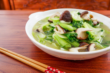 Fried rape with mushrooms on the table