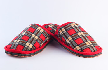 Checkered indoor slippers isolated on white background.