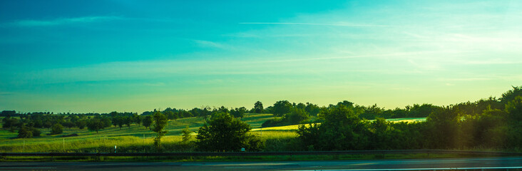 Obraz premium Germany, Frankfurt, Sunrise, a rainbow over a body of water