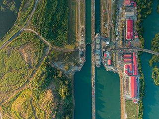 Beautiful aerial view of the Beautiful aerial view of the Panama Channel on the Sunset - obrazy, fototapety, plakaty
