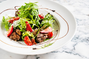 salad with strawberries and duck liver