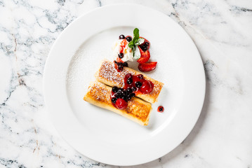 pancakes with strawberries and mint