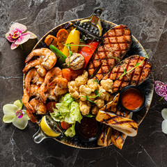 grilled seafoodwith vegetables and sauce