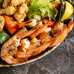 grilled seafoodwith vegetables and sauce