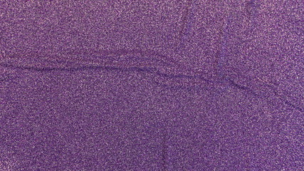 purple shiny paper background with texture of bends and wrinkled lines