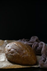 Rye or wheat dark bread with leaven or yeast with a golden crust